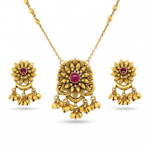 Beautiful 22KT yellow gold pendant set featuring floral motif pendant with ruby center stone, dangling gold bead charms, and matching earrings on a white background.