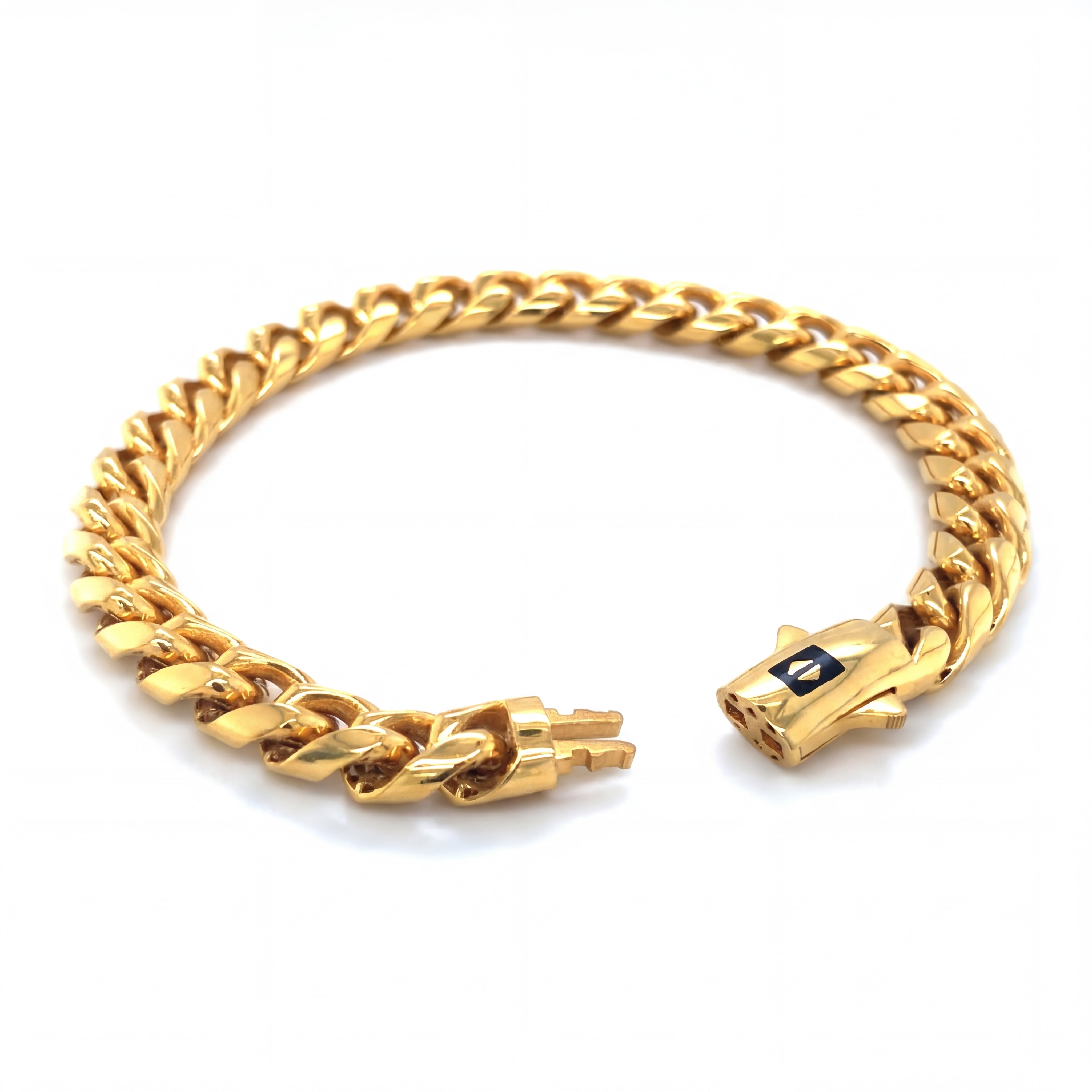 Bold 22KT gold bracelet featuring classic Cuban curb chain links with polished finish and secure clasp on a white background.