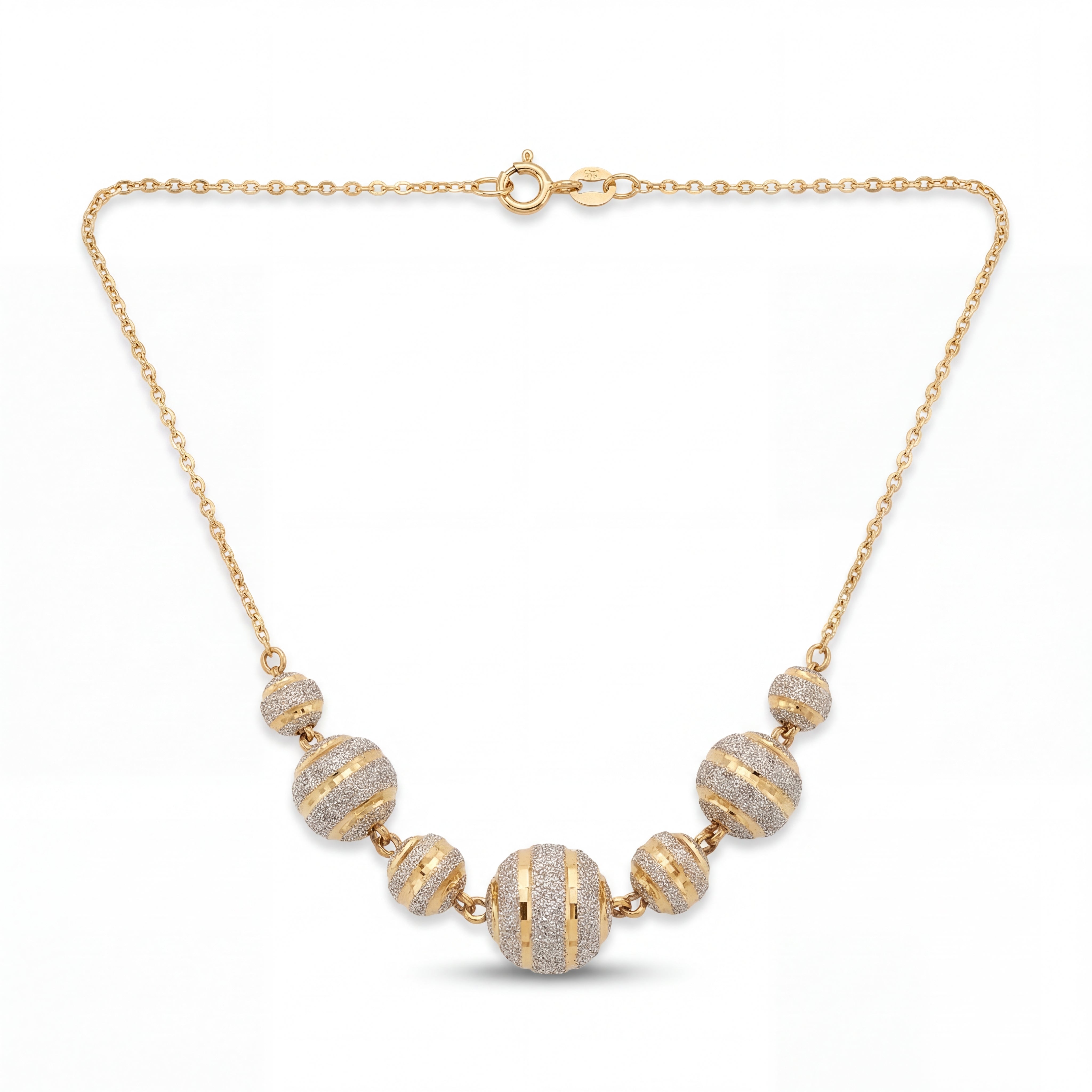Elegant 22KT yellow gold necklace featuring graduated round beads with sparkling textured stripe detailing on a delicate chain against a white background.