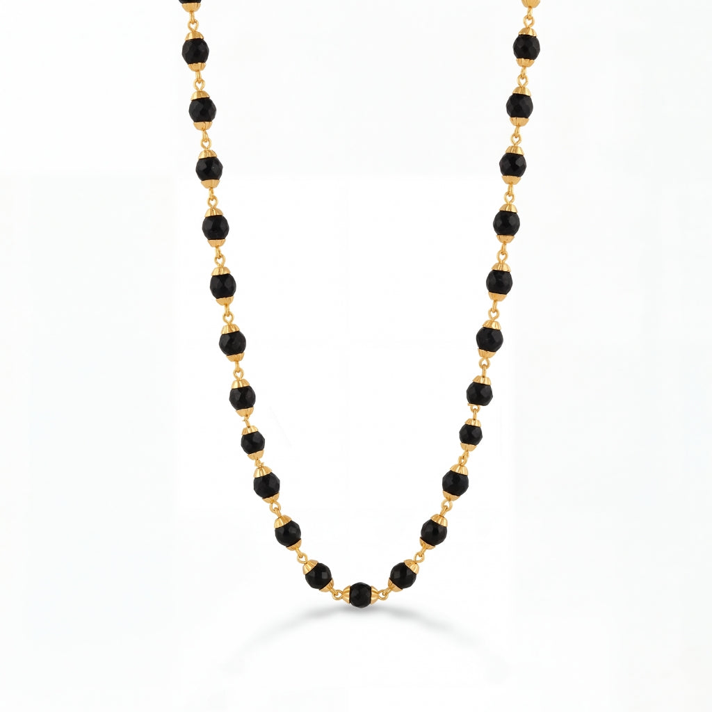 22K gold black bead mangalsutra featuring faceted black beads linked with polished gold connectors, offering a lightweight, elegant, and timeless design for everyday wear.
