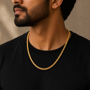 Man wearing a 22K gold classic wheat chain featuring a smooth, tightly woven design with a polished finish, styled with a black t-shirt for an elegant everyday look.