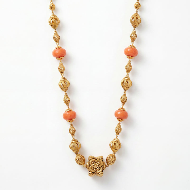 22K gold coral bead floral necklace featuring polished coral beads, intricately crafted filigree gold beads, and an ornate floral centerpiece, designed for a graceful and timeless traditional look.