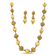 Traditional 22K yellow gold necklace set featuring alternating textured designer beads and glossy faceted beads with matching drop earrings.