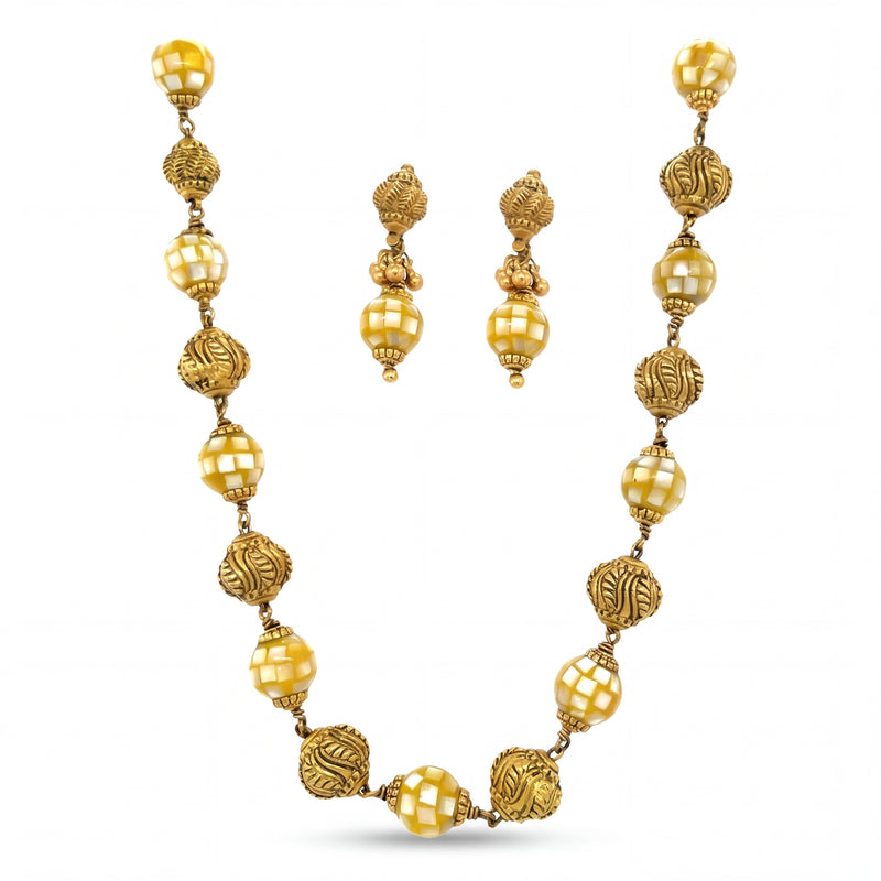 Traditional 22K yellow gold necklace set featuring alternating textured designer beads and glossy faceted beads with matching drop earrings.