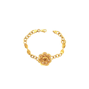 Elegant 22K yellow gold bracelet featuring a detailed floral filigree centerpiece with textured chain links and a secure clasp on a white background.