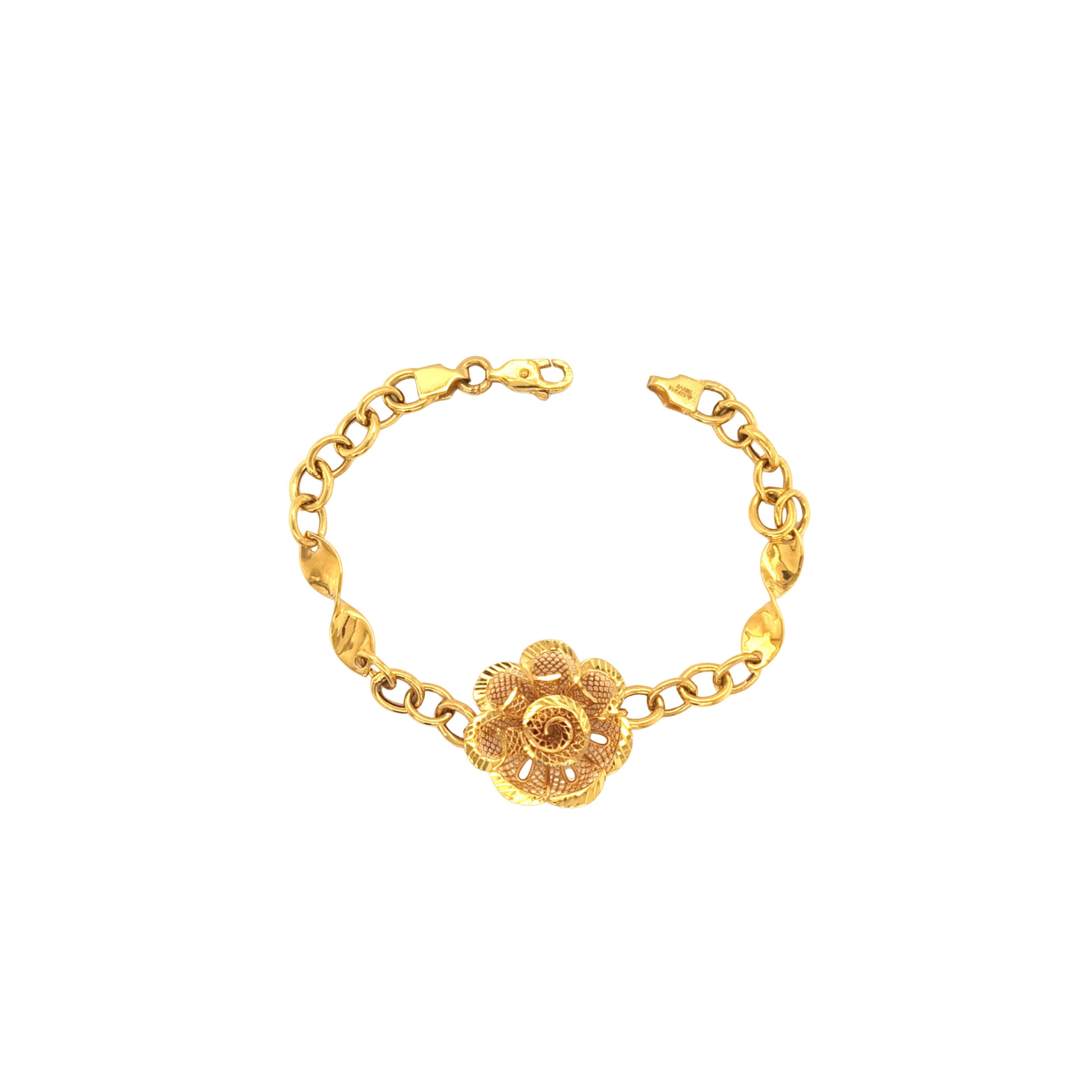 Elegant 22K yellow gold bracelet featuring a detailed floral filigree centerpiece with textured chain links and a secure clasp on a white background.
