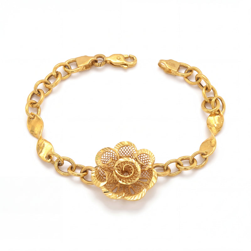 Elegant 22K yellow gold bracelet featuring a detailed floral filigree centerpiece with textured chain links and a secure clasp on a white background.