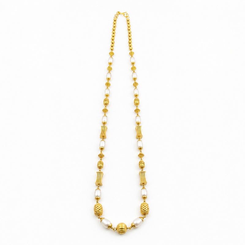 22K gold pearl beaded necklace featuring lustrous white pearls, intricately textured gold beads, decorative barrel-shaped accents, and a polished gold centerpiece, designed for a timeless and elegant traditional look.