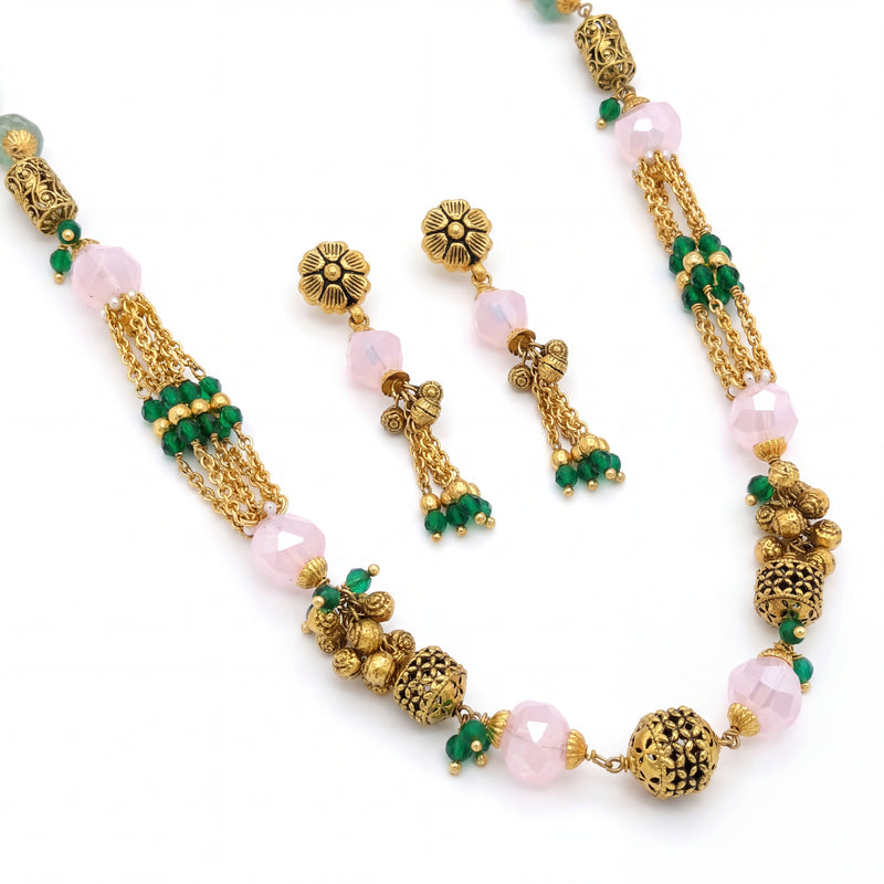 Elegant 22K yellow gold necklace set featuring faceted pink quartz beads, green stone tassel strands, antique gold accents, and matching floral drop earrings.