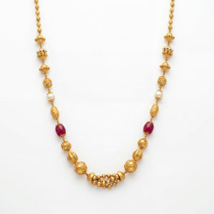 22K gold ruby pearl beaded necklace featuring deep ruby-colored beads, lustrous white pearls, intricately textured gold beads, and a traditional gold beaded centerpiece, crafted for an elegant and timeless ethnic look.