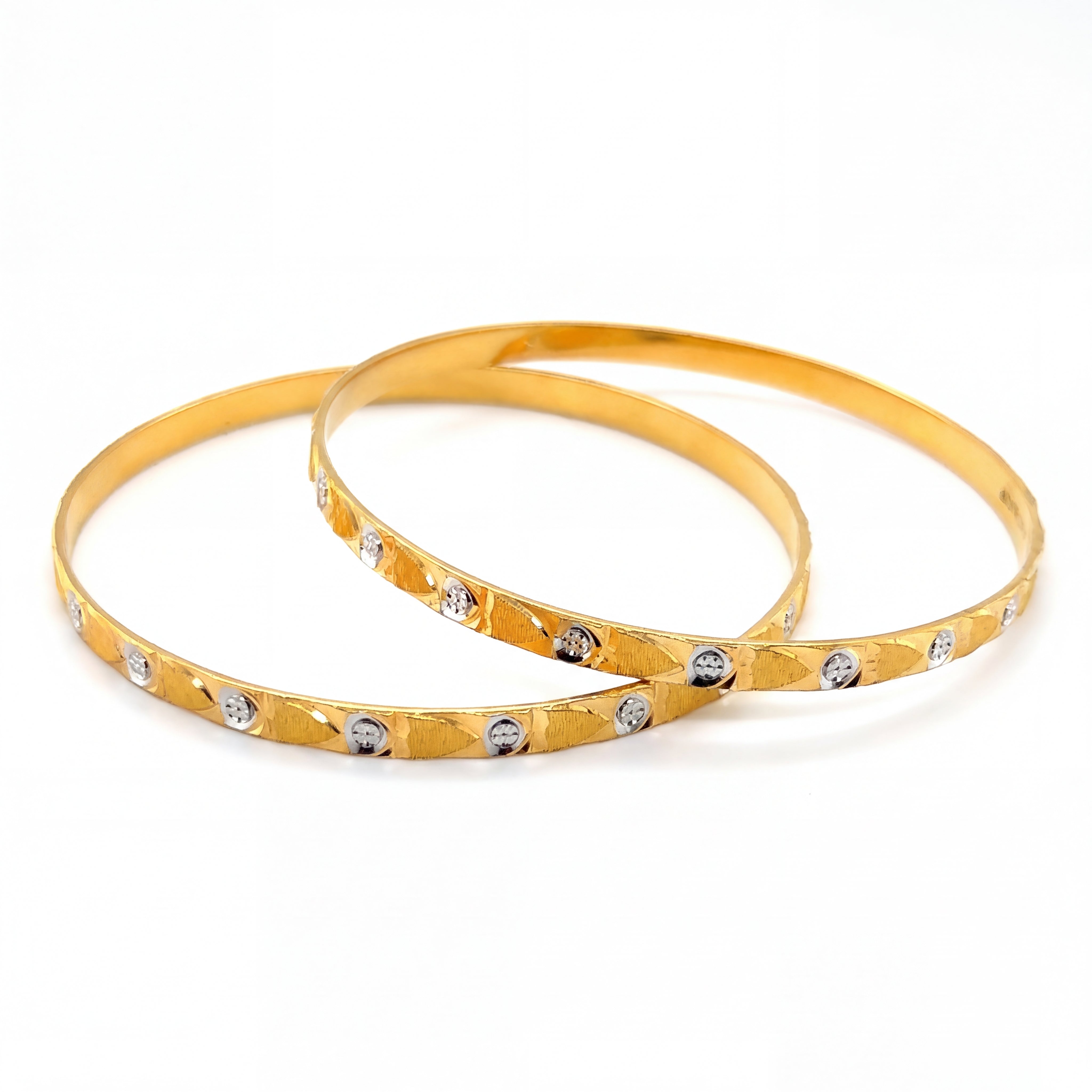 Elegant 22K yellow gold slim bangles pair featuring textured stardust finish with round white diamond illusion accents in a lightweight everyday design.