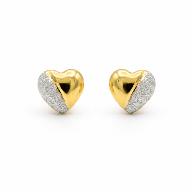 Elegant 22K yellow gold two tone heart stud earrings featuring polished gold finish with textured white rhodium diagonal detailing by Pachchigar Jewellers Ashokbhai