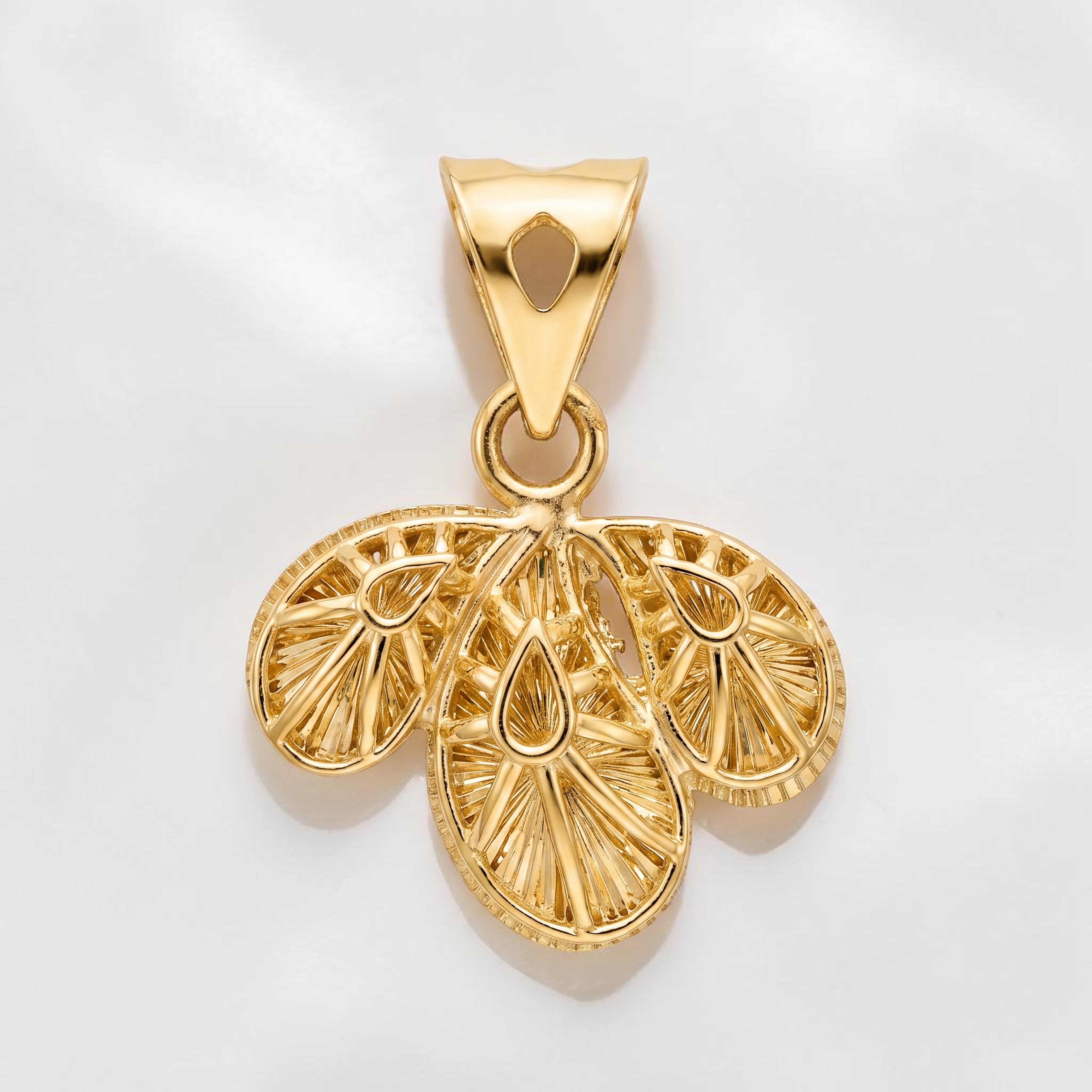 Yellow gold pendant featuring a three-leaf design with intricate engraved detailing and textured patterns, creating a traditional and elegant look.