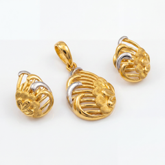Elegant gold jewellery set featuring a rounded openwork pendant and matching earrings with intricate gold filigree, textured floral motifs, and contrasting white-gold accents.