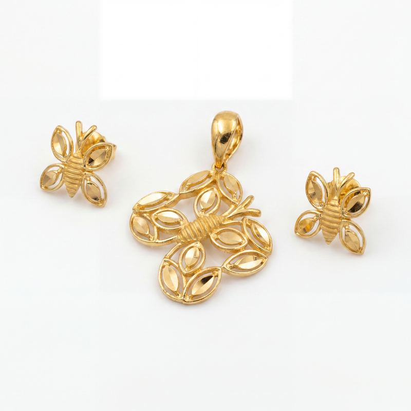Elegant gold jewellery set featuring a bee-inspired pendant and matching earrings with intricate wing-shaped detailing, polished gold accents, and a graceful nature-inspired design.