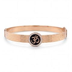 Rose gold textured kada featuring a central Om symbol set on black enamel, encircled by a halo of diamonds, combining spirituality with elegant contemporary design.