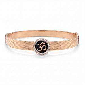 Rose gold textured kada featuring a central Om symbol set on black enamel, encircled by a halo of diamonds, combining spirituality with elegant contemporary design.