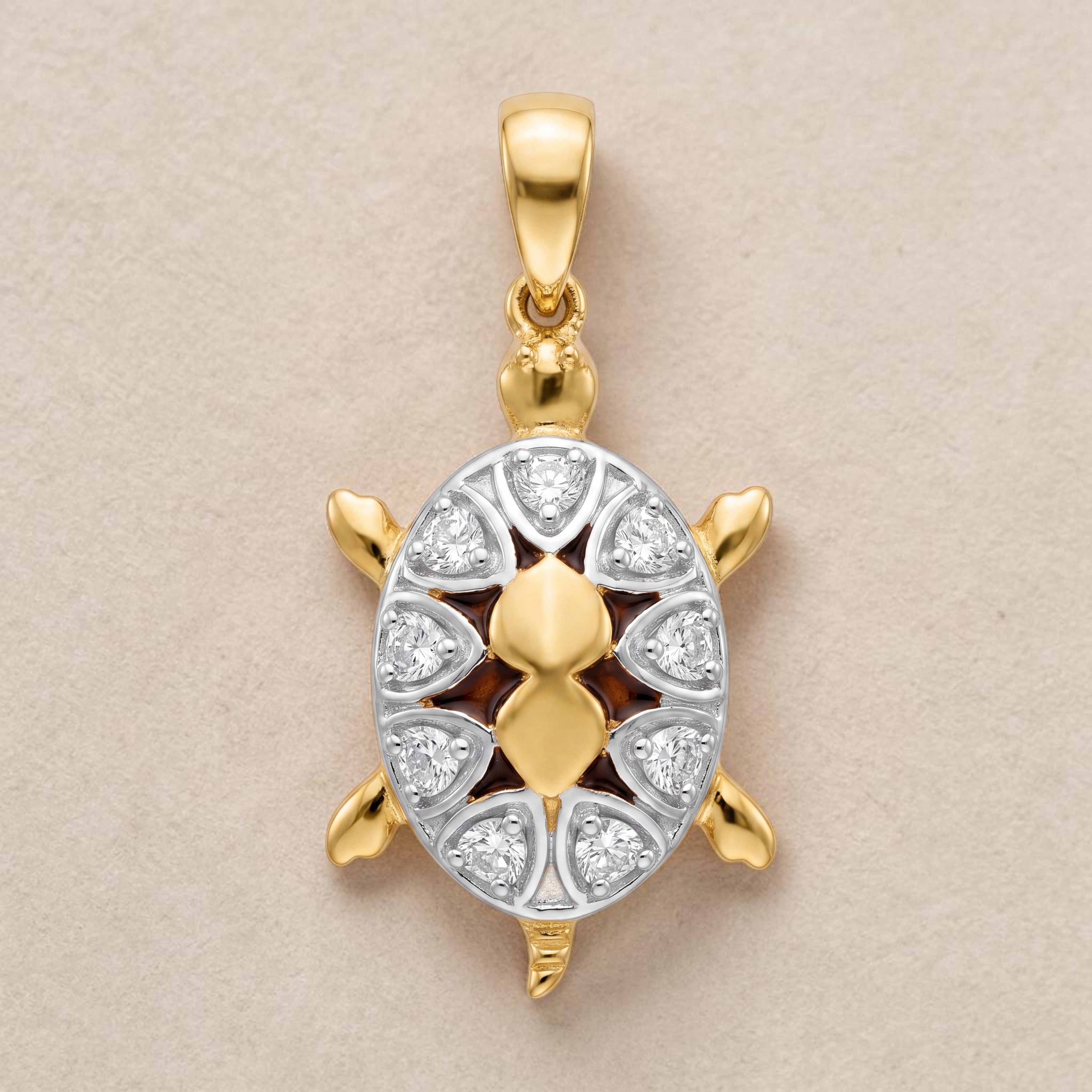 Yellow gold turtle-shaped pendant featuring a detailed shell design with white gold accents and embedded diamonds, symbolizing protection, longevity, and prosperity.