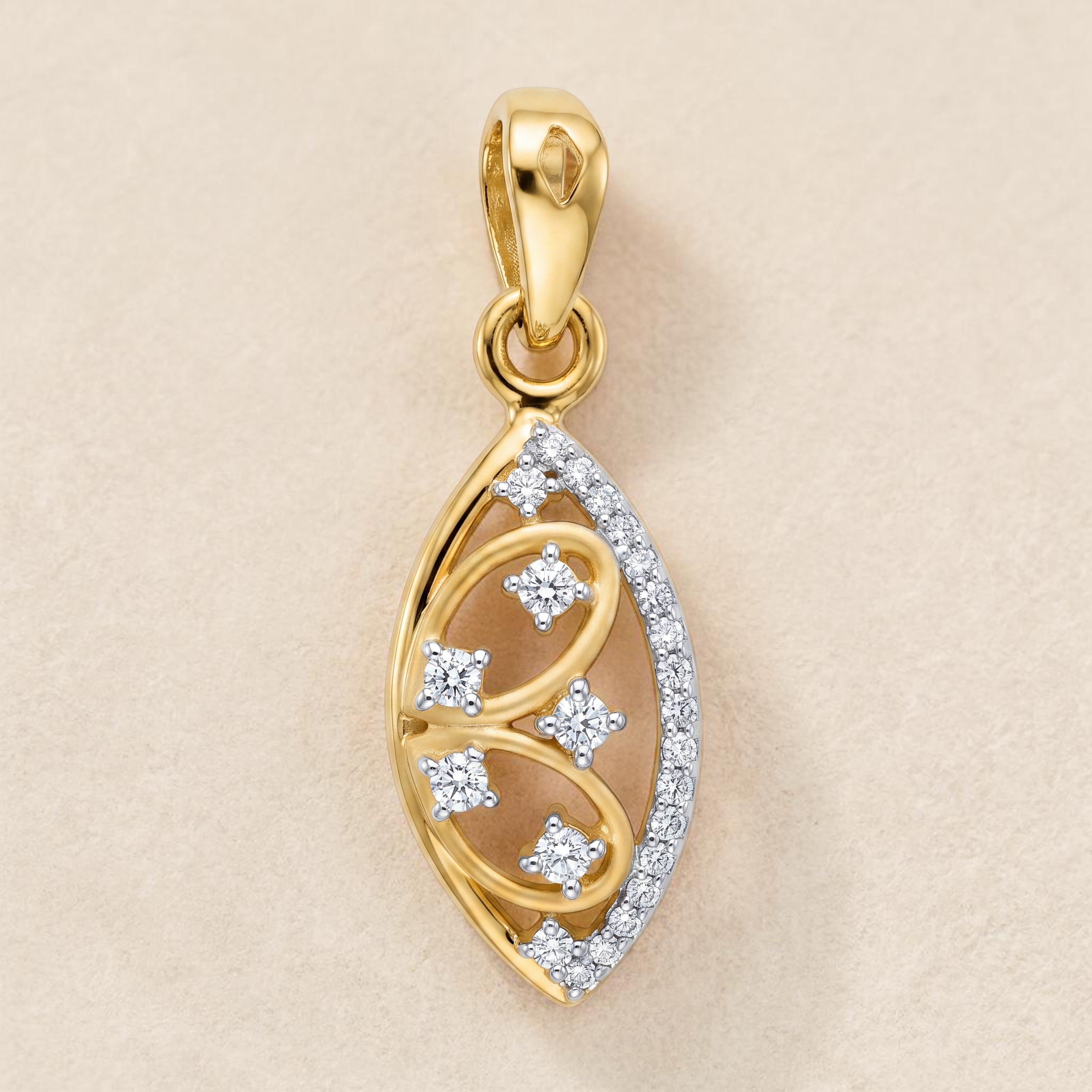 Yellow gold pendant featuring a leaf-shaped silhouette with a graceful swirl design, accented by round diamonds and a pavé diamond border for a refined and timeless look.