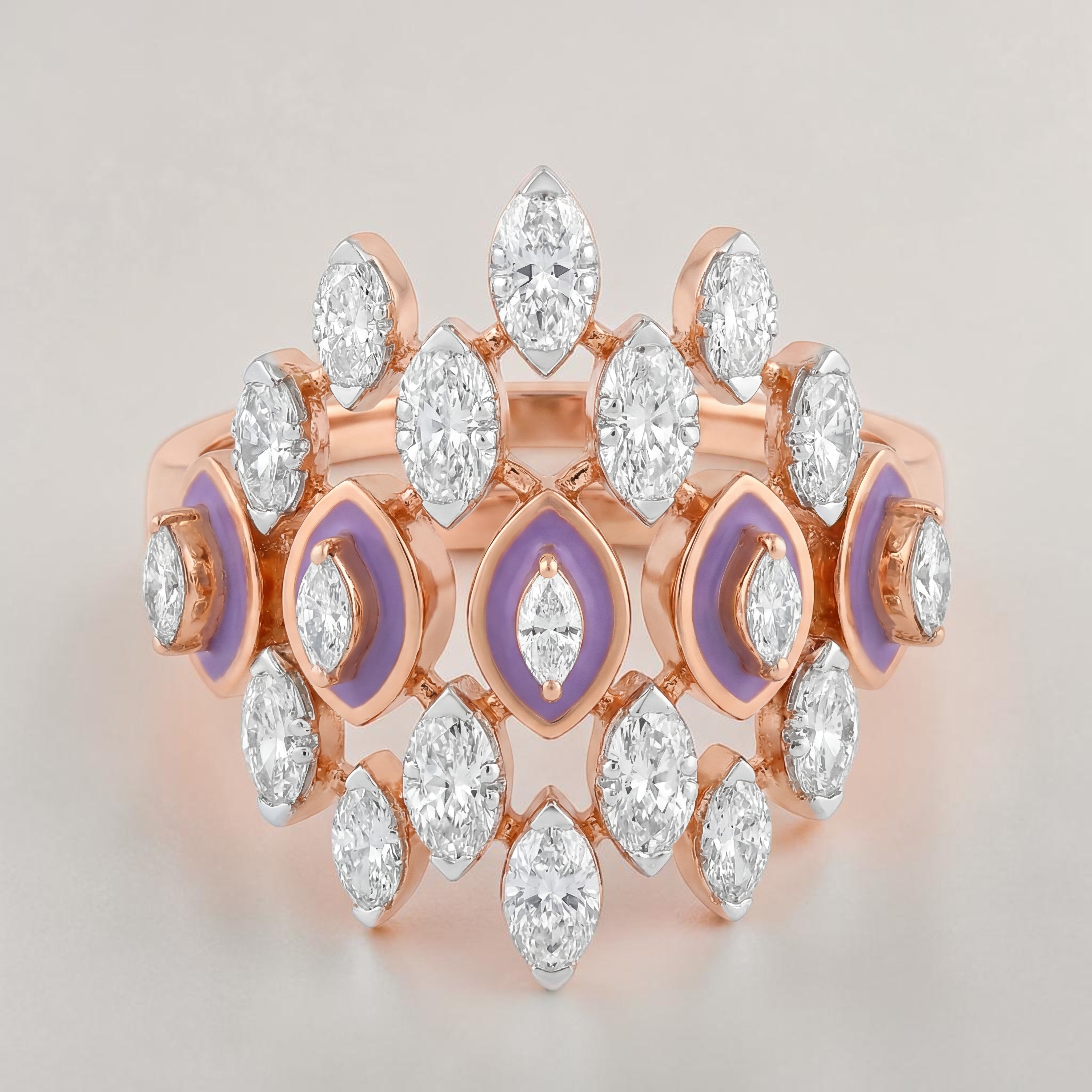 Rose gold statement ring featuring multiple marquise-cut diamonds arranged in a layered crown design, accented with soft lavender enamel detailing and a central marquise diamond for a bold, contemporary look.