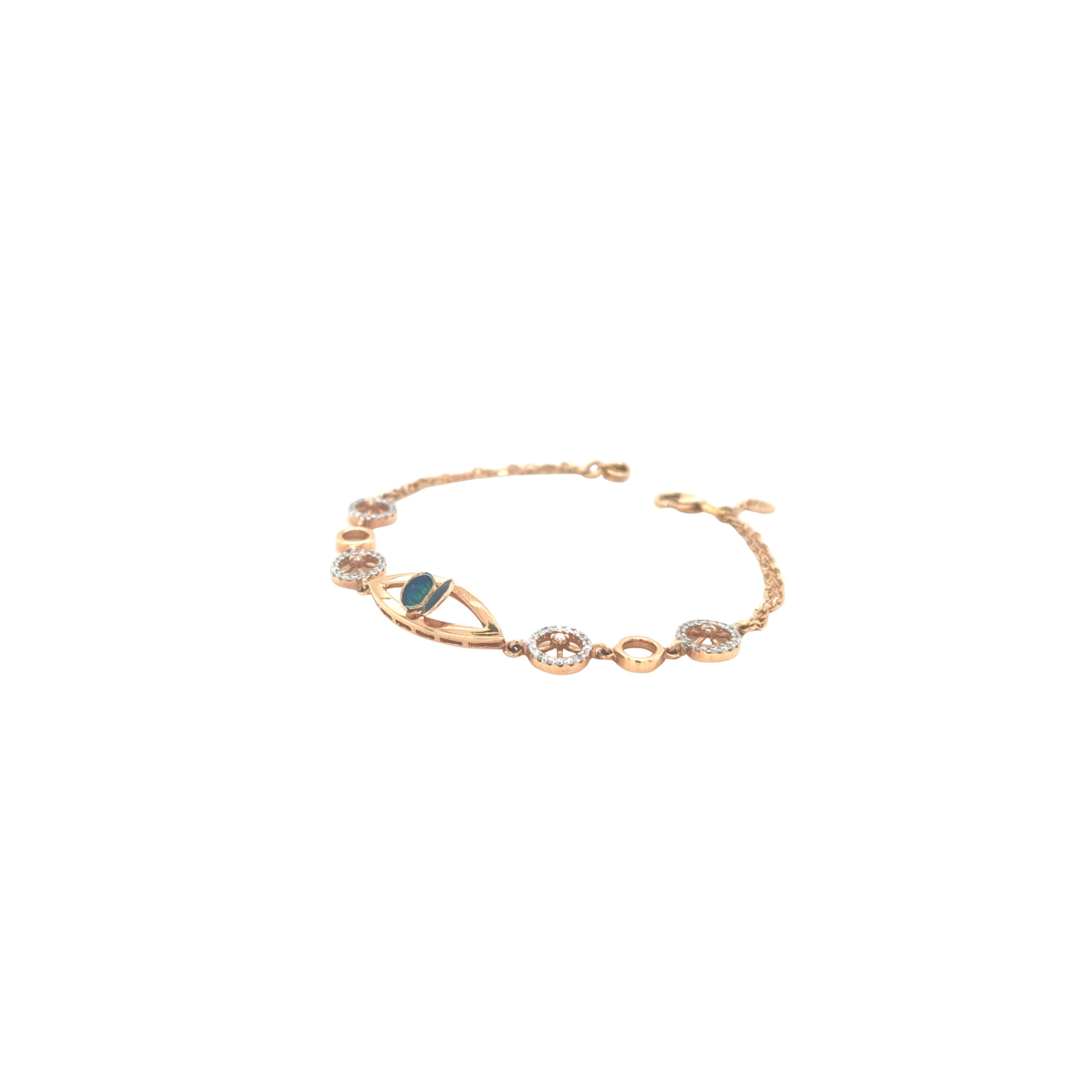 Stylish rose gold bracelet featuring an evil eye centerpiece with blue opal accents and sparkling circular diamond motifs on a delicate chain with adjustable clasp.
