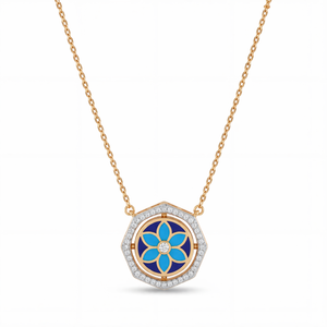 Elegant gold necklace featuring a hexagon-shaped pendant with blue floral enamel detailing and sparkling diamond accents on a white background.