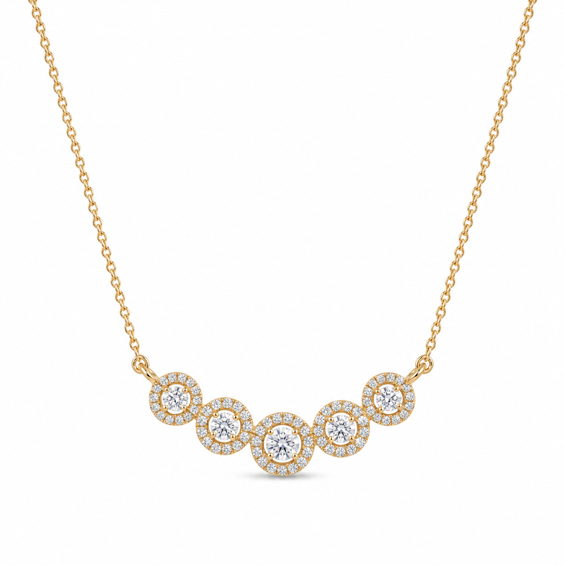 Elegant gold necklace featuring five sparkling round diamond halo motifs arranged in a graceful curved design on a white background.