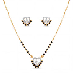 Elegant gold mangalsutra jewelry set featuring black beads, a heart-shaped diamond pendant, and matching heart stud earrings on a white background.