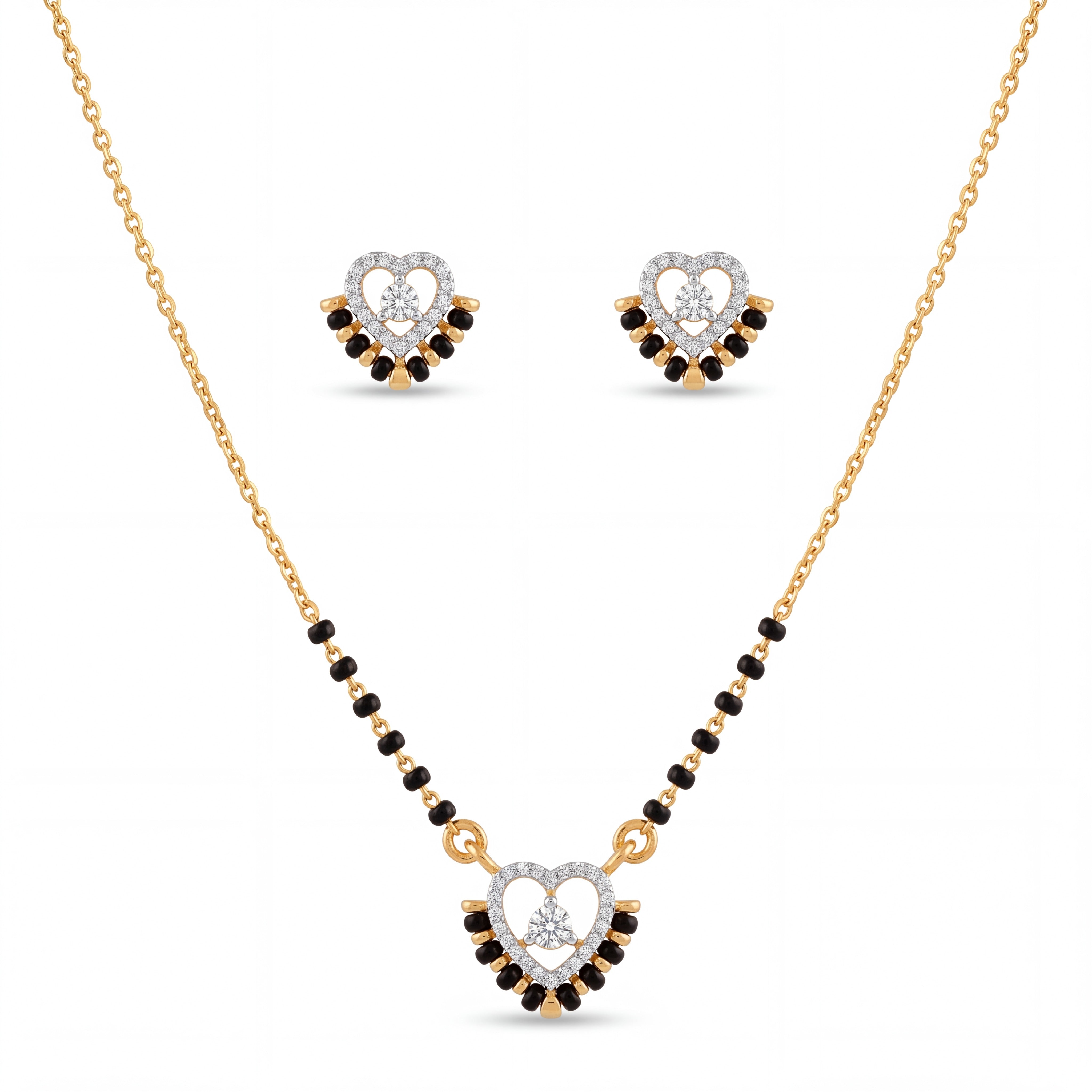 Elegant gold mangalsutra jewelry set featuring black beads, a heart-shaped diamond pendant, and matching heart stud earrings on a white background.
