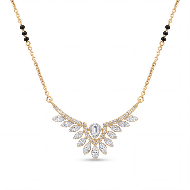 Elegant gold mangalsutra necklace featuring black beads and a dazzling diamond leaf wing pendant with a central emerald-cut diamond on a white background.