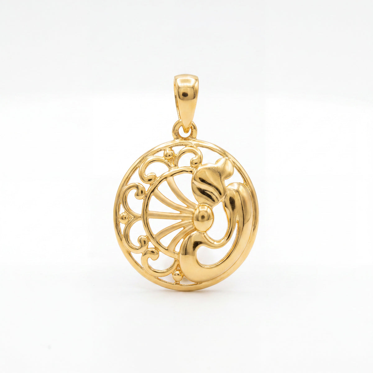 Intricate round gold pendant featuring an openwork floral design with curved filigree details and a polished center, crafted in an elegant traditional style.