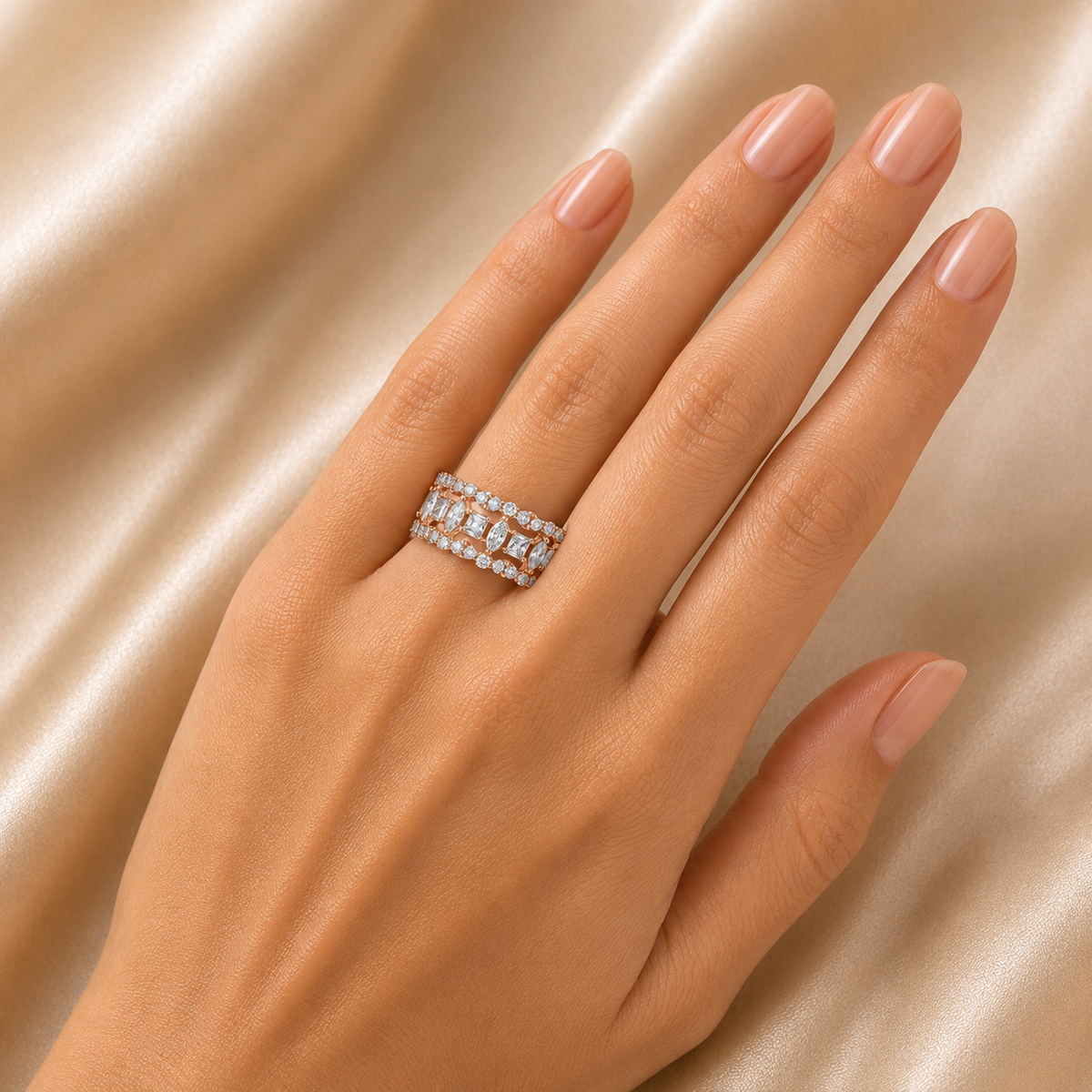 Elegant gold diamond band ring featuring a rectangular geometric pattern with alternating round and baguette-cut diamonds arranged in a refined layered design.
