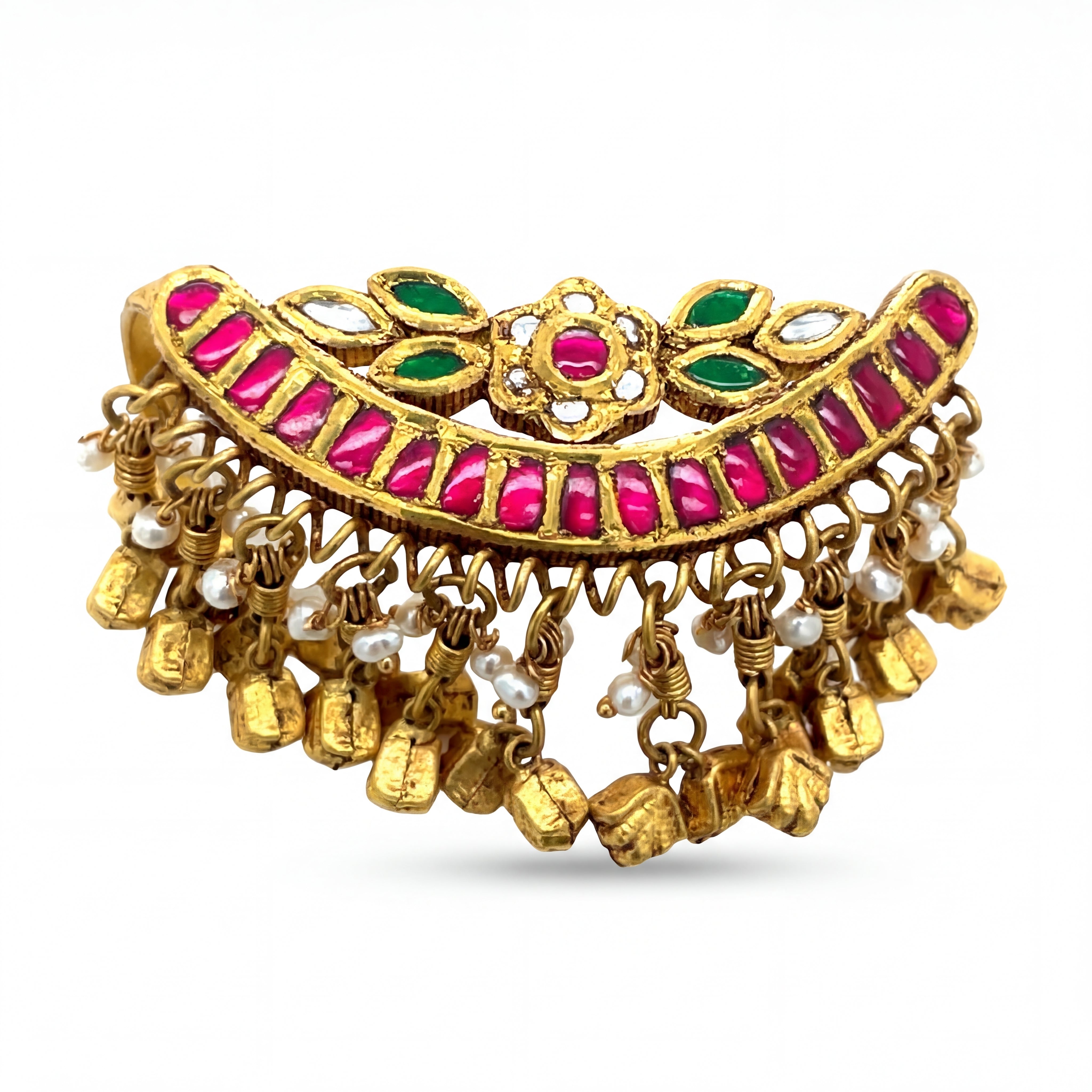 Traditional gold bracelet featuring vibrant kundan-set red and green stones, accented with pearl drops and dangling ghungroo charms, showcasing an ornate and festive ethnic design.