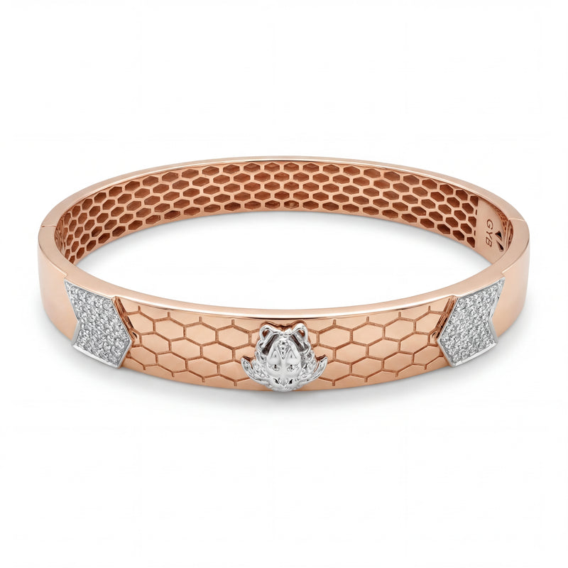 Rose gold kada featuring a honeycomb-textured design with a central panther head motif in white gold, accented by diamond-set panels on the sides for a bold and contemporary look.