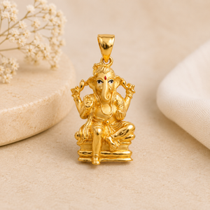 Intricately crafted gold Lord Ganesha pendant depicting the deity seated in a traditional pose, with detailed ornamental work and a polished gold finish.