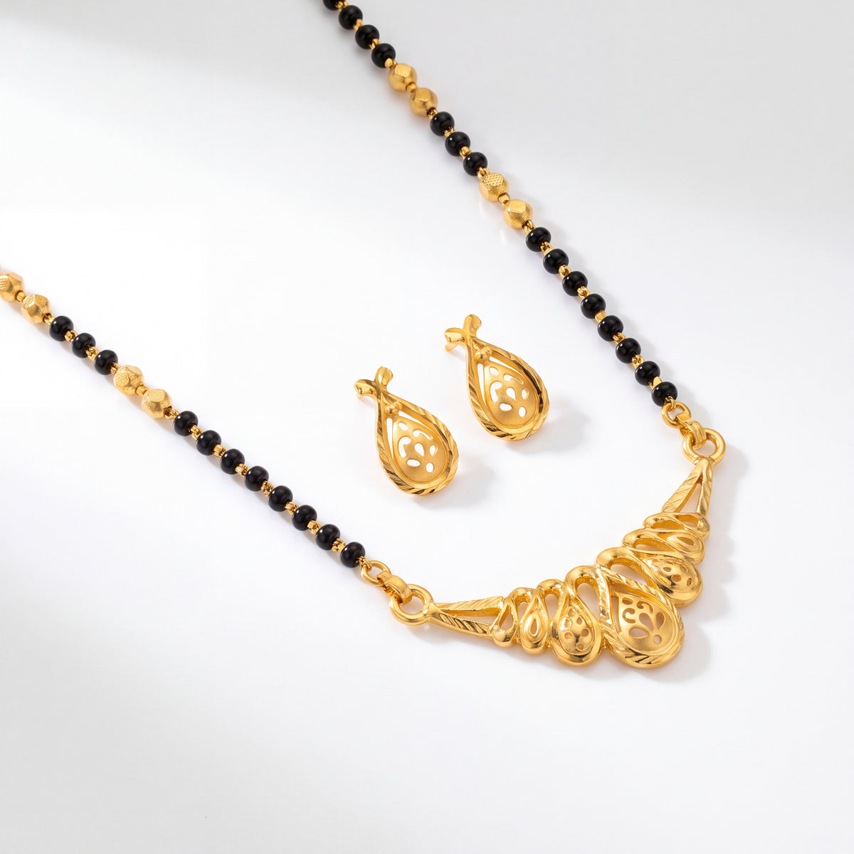 Gold Mangalsutra Set with Paisley Pendant & Black Beads