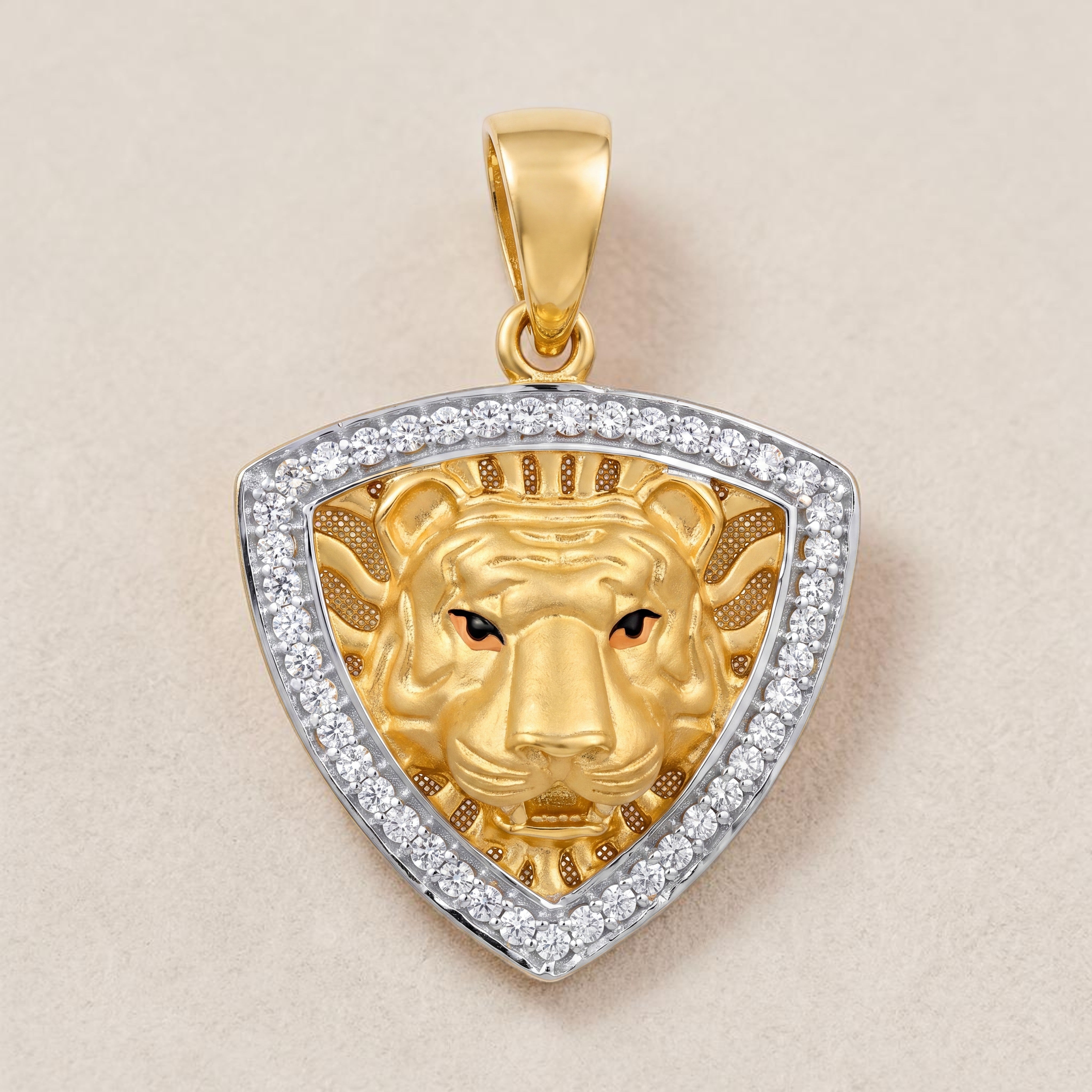 Yellow gold pendant featuring a detailed lion face motif set within a triangular shield frame, bordered with sparkling diamonds for a bold and powerful statement design.
