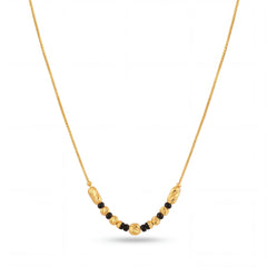 Stylish gold mangalsutra featuring delicate chain, black bead detailing, decorative gold center beads, and a graceful lightweight design for everyday wear.