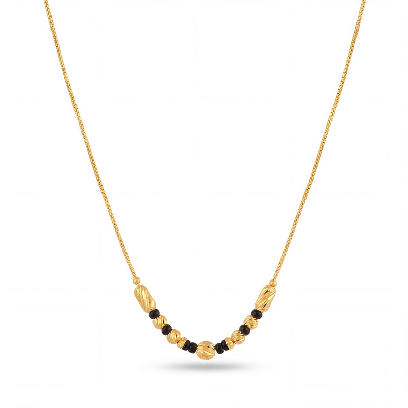 Stylish gold mangalsutra featuring delicate chain, black bead detailing, decorative gold center beads, and a graceful lightweight design for everyday wear.