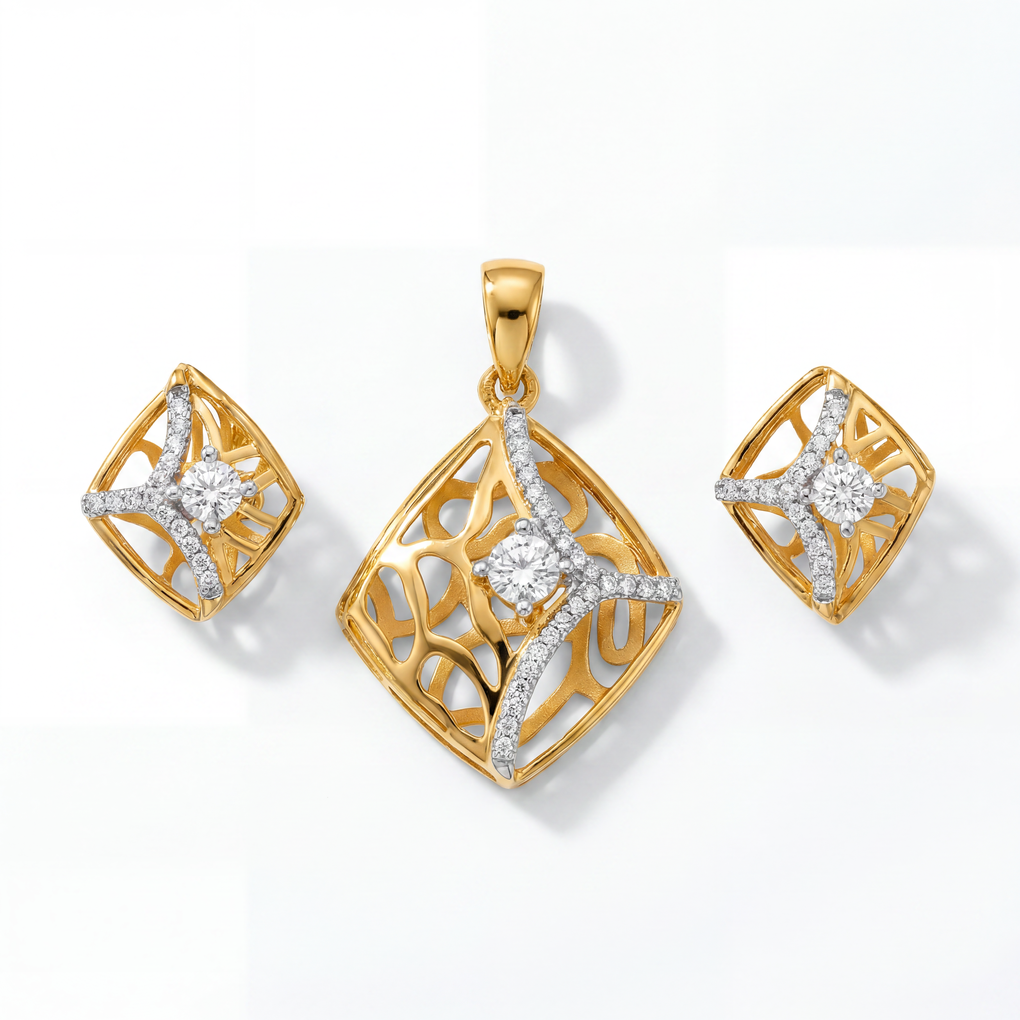 Elegant two-tone gold jewellery set featuring a geometric pendant and matching earrings with sparkling diamond accents, intricate openwork patterns, and contemporary star-inspired detailing.