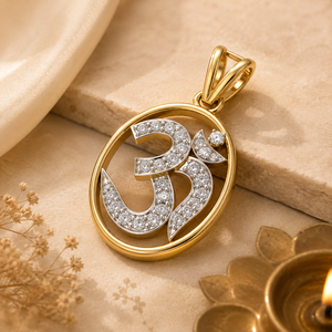 Gold Om pendant featuring a diamond-studded Om symbol within a polished oval gold frame, finished with an elegant double-loop gold bail.