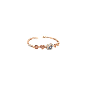 Elegant rose gold bracelet featuring heart motifs, a square blue sapphire centerpiece, and sparkling diamond accents with an adjustable clasp on a white background.