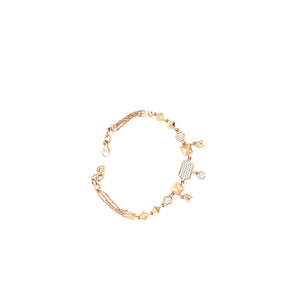 Stylish rose gold bracelet featuring geometric pyramid motifs, sparkling diamond accents, and dangling charm details with an adjustable chain clasp on a white background.