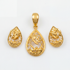 Elegant gold jewellery set featuring a teardrop-shaped pendant and matching earrings with intricate filigree work, floral accents, flowing motifs, and polished gold detailing.