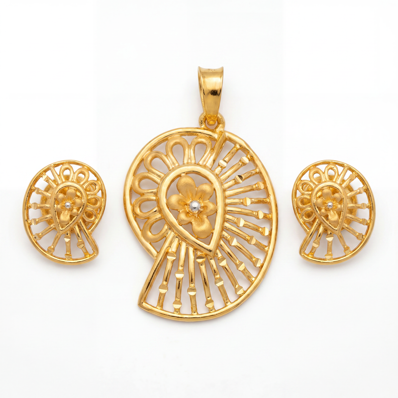 Elegant gold jewellery set featuring a paisley-inspired pendant and matching earrings with a central floral motif, intricate radial openwork, and polished gold detailing.