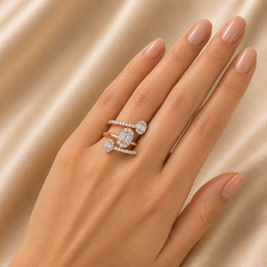 Contemporary rose gold ring featuring multiple open bands adorned with baguette and round-cut diamonds arranged in an elegant geometric design.