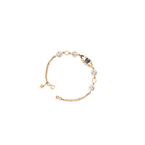 Stylish rose gold bracelet featuring an evil eye centerpiece with blue opal accents and sparkling circular diamond motifs on a delicate chain with adjustable clasp.