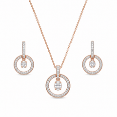 Elegant rose gold diamond jewelry set featuring a circular pendant necklace with matching dangling circle earrings on a white background.