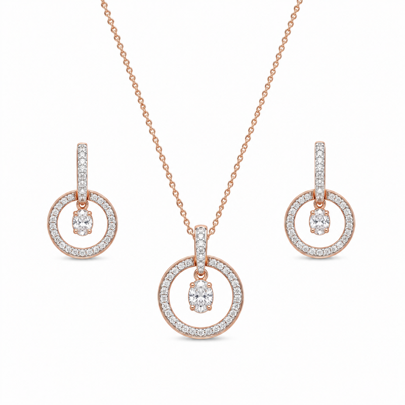 Elegant rose gold diamond jewelry set featuring a circular pendant necklace with matching dangling circle earrings on a white background.