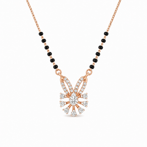 Elegant rose gold mangalsutra necklace featuring black beads and a sparkling floral-inspired diamond drop pendant with intricate detailing on a white background.